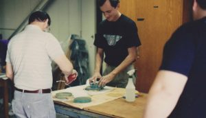 two men working on telescope - 1990