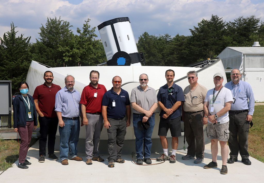 Team standing in front of RC700 at NASA